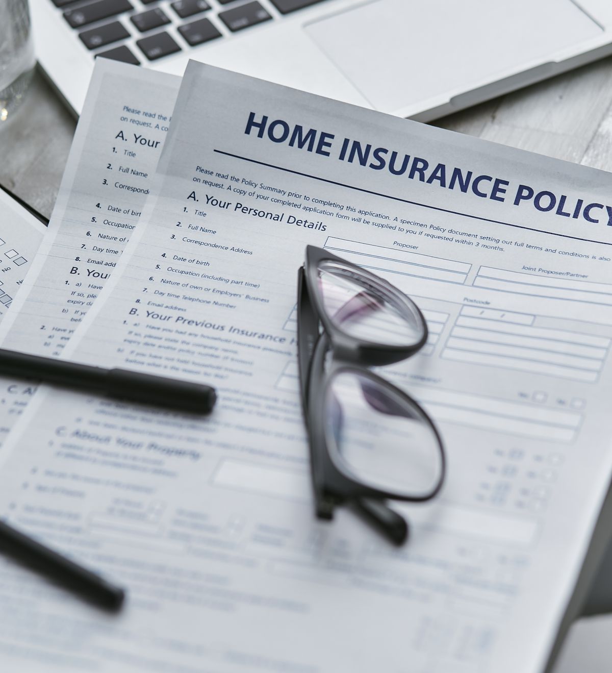 Insurance advisor discussing coverage and risk documentation with a client
