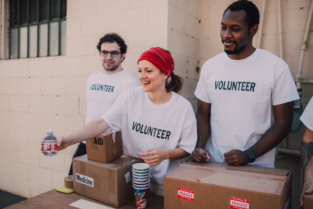 Volunteers organizing community support resources for a nonprofit program